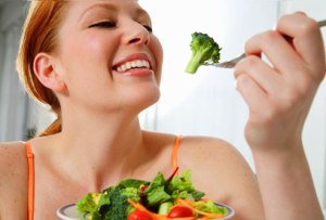 getty_rm_woman_eating_vegetables